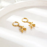 Miniature balloon dog earrings – Gold hoops with fun dog pendant